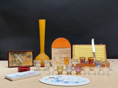 a table with a lot of glasses and a bottle of wine