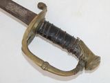 a very old sword that is on display on the wall