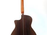 a close up of a guitar on a stand against a white background