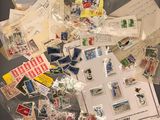 a pile of stamps and envelopes on a table