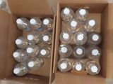 many bottles of water in a box on the floor