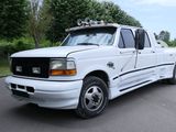 a white truck parked on the side of the road