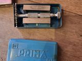 a blue box with a razor on it next to a blue box with a razor on it