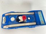 a blue toy car with a red hat on top of it