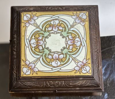 a small wooden box with a decorative design on it