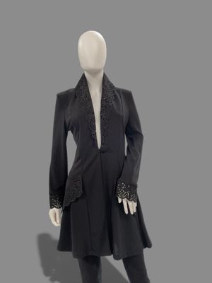 an image of a mannequin dressed in a black coat and black pants