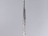 a close up of a flute on a stand with a white background