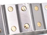 a close up of a bracelet with gold buttons on it