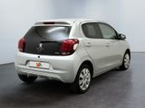 a picture of a small white car parked in a room