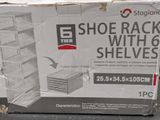 a box of shoes rack with shelves in it
