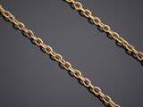 a gold chain on a black background