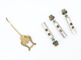 three different types of brass pipes and fittings on a white surface