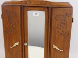 a small wooden cabinet with a mirror on top of it