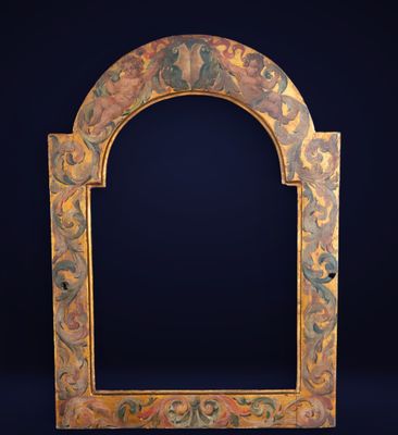 an ornately painted wooden frame with a black background