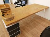 a desk with a basket on top of it in a room