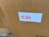 a cardboard box with a label on it sitting on the floor