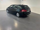 a picture of a black car parked in a garage