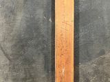 a wooden cross that is on the wall of a building