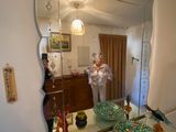 a woman taking a picture of herself in the mirror