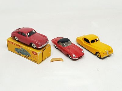 three toy cars that are sitting on top of a box