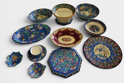 a lot of different plates and bowls on the table