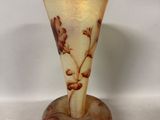 a glass vase that is sitting on a table