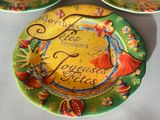 three plates with different designs on them on a table
