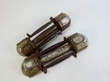 three old metal screws on a white surface