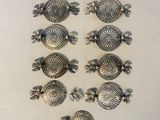 six antique silver plated turtle knobs on a white surface