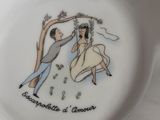 a plate with a drawing of a man and a woman on it