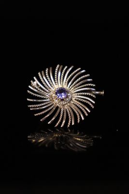a close up of a ring on a black surface