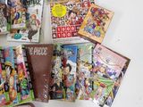 a lot of anime books on the table