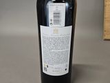 a bottle of wine that is sitting on a table