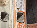 an image of a ladder that has been painted orange and white