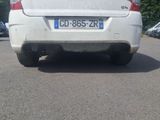 a white car that is parked in a parking lot