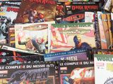 a lot of comic books on the table together