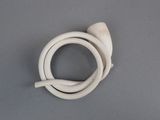 a small white object on a table with a gray background