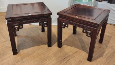 pair of asian style side tables on hardwood flooring in a living room