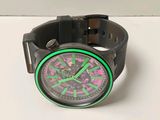 a watch that is sitting on a white surface