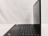 the back of a laptop computer sitting on top of a white table