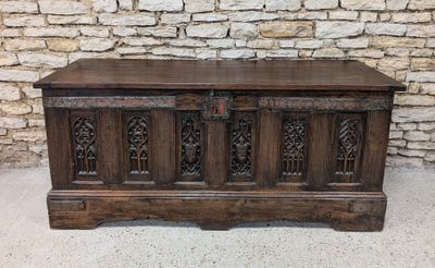 an old wooden chest with carvings and carvings on the front