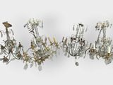 many chandeliers that are hanging on the wall