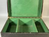 a green box that has four compartments inside of it