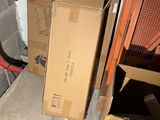 a pile of boxes sitting on the floor in a room