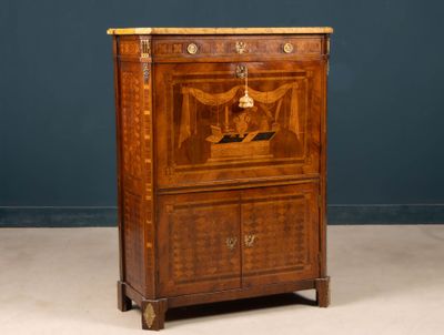 an old wooden cabinet with a bird on top of it