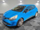 a blue car is parked in a room with a checkered floor