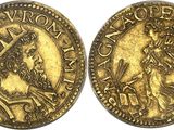 a gold coin with a crown on the front and a crown on the back