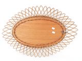 a wooden plate with a decorative design on it
