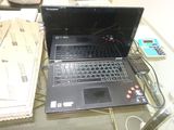 a laptop computer that is sitting on a glass table