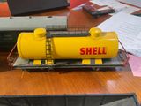 a model of a yellow tank sitting on a table